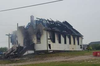 The charred remains of St. Bernard’s Church in Grouard, Alta., following a May 22 fire that destroyed the church.