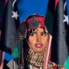 A young Libyan woman wearing a traditional garb participates in a Feb. 16 ceremony to mark the anniversary of the Feb. 17 beginning of the Libyan revolution. The head of Benghazi&#039;s diminished Catholic community spoke of a need to rebuild his congregation and of the uncertainties ahead.