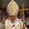 Pope Benedict XVI delivers his blessing as he leaves after celebrating Christmas Mass in St. Peter&#039;s Basilica at the Vatican Dec. 24