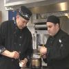 Jacob Dias works with guest chef David Wolfman.