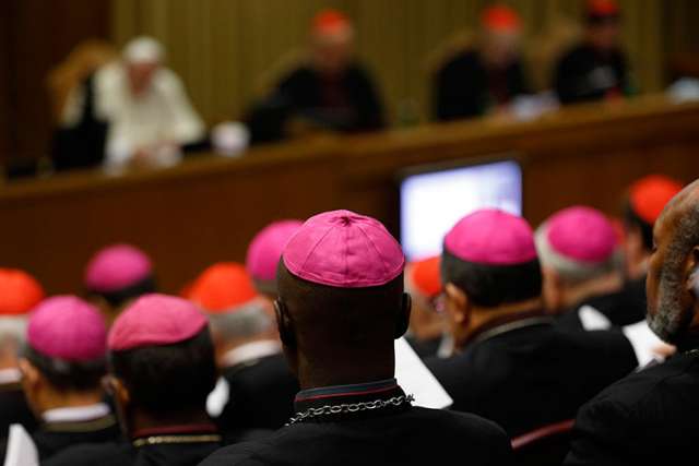 Bishops and cardinals attend the morning session of the extraordinary Synod of Bishops on the family at the Vatican Oct. 13.