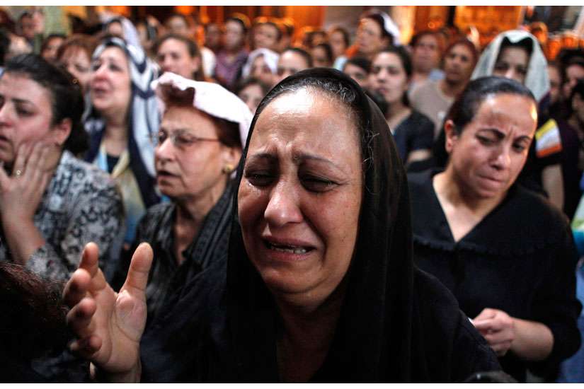 A Coptic Christian woman cries during a prayer service at a church in Cairo May 8.