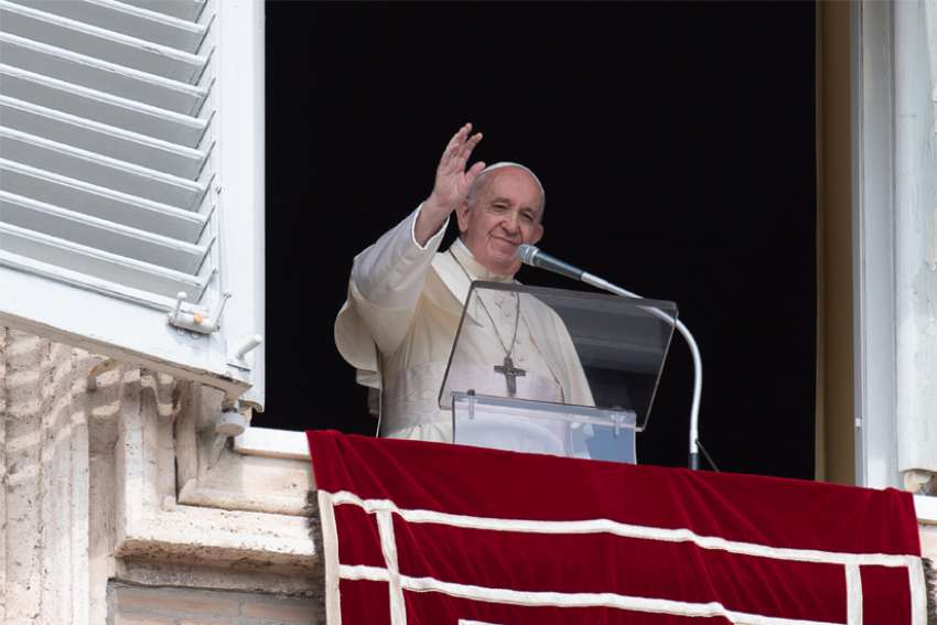 Pope Francis waves as he leads the Angelus from the window of his studio overlooking St. Peter&#039;s Square at the Vatican Sept. 20, 2020. Commenting on the day&#039;s Gospel reading, the pope warned that if the church fails to go out and proclaim the Gospel to those who are lost or forgotten, it risks falling ill to the evil that is committed by its own members.