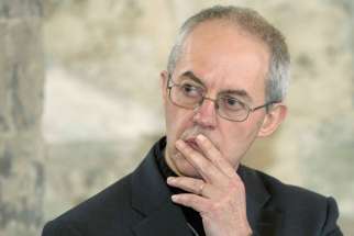 Archbishop Justin Welby of Canterbury, England, spiritual leader of the Anglican Communion, listens during a news conference at Lambeth Palace in London Feb, 20, 2014.