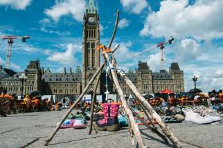 A memorial for unmarked graves at residential schools sits on Parliament Hill, which was the scene for the end of the Walk of Sorrow on Aug. 22. Residential school survivor Patricia Ballantyne completed a 79-day journey from Saskatchewn that began after the discovery of unmarked graves at a former residential school in Kamloops, B.C.