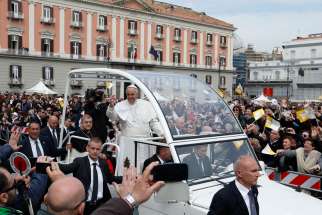 Pope Francis greets the crowd after celebrating Mass in Piazza Plebiscito in Naples, Italy, March 21. 
