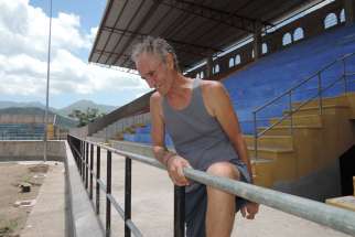 Franciscan Father Alberto Gauci looks over a soccer stadium he is helping to build in Juticalpa, Honduras, where he has promoted public works projects for the past 31 years. The stadium, which cost approximate $2 million, is nearing completion.