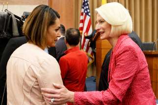 Salwa Khalaf Rasho, a human rights activist who escaped Islamic State captivity, talks with Callista Gingrich, U.S. ambassador to the Vatican, during a symposium on religious freedom presented by the U.S. Embassy to the Holy See in Rome June 25. 