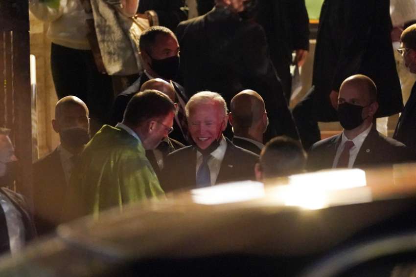 U.S. President Joe Biden speaks with Paulist Father Steven J. Petroff after attending a Saturday evening Mass at St. Patrick&#039;s Church during a break in the G-20 summit in Rome Oct. 30, 2021.
