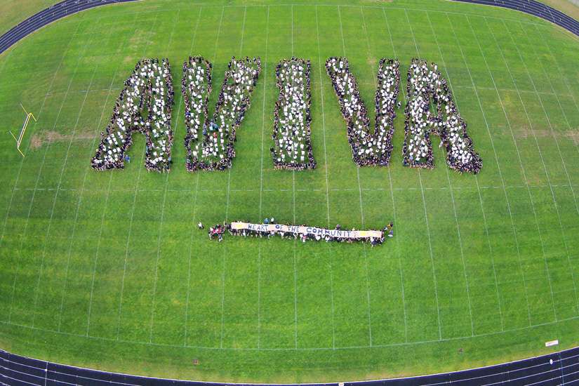 Students at St. Benedict Catholic High School in Cambridge Ont., show their appreciation on the soon-to-be upgraded sports field for the $100,000 awarded to it by the Aviva Community Fund to help pay for those improvements.