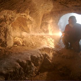 Simcha Jacobovici examines a 1st century burial tomb in The Jesus Discovery.