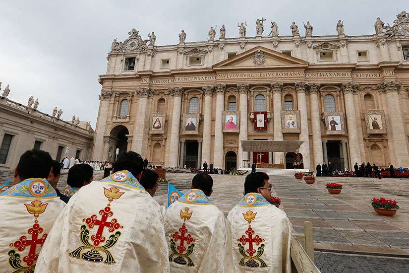 Priests from India wait for the start of the canonization Mass of six new saints celebrated by Pope Francis in St. Peter&#039;s Square at the Vatican Nov. 23. The new saints are: Euphrasia Eluvathingal, an Indian Carmelite sister and member of the Syro-Malaba r Catholic Church; Ludovico of Casoria, an Italian Franciscan priest who founded the Grey Franciscan Friars of Charity and the Grey Franciscan Sisters of St. Elizabeth; Giovanni Antonio Farina, an Italian bishop of Vicenza and the founder of the Teaching Sisters of St. Dorothy; Kuriakose Elias Chavara, the Indian founder of the Carmelites of Mary Immaculate, a Syro-Malabar Catholic order; Nicholas of Longobardi, an Italian friar of the Minim order; and Amato Ronconi, a 13th-century Italian lay Francisca n and founder of a hospice for the poor, which is now a home for the elderly in Rimini, Italy.