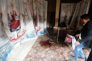 Blood stains are seen Dec. 29 on the floor of the Coptic Orthodox Church of Mar Mina in Helwan, Egypt, near Cairo. At least nine people were killed in attacks on the church and a Christian-owned shop, authorities said. 