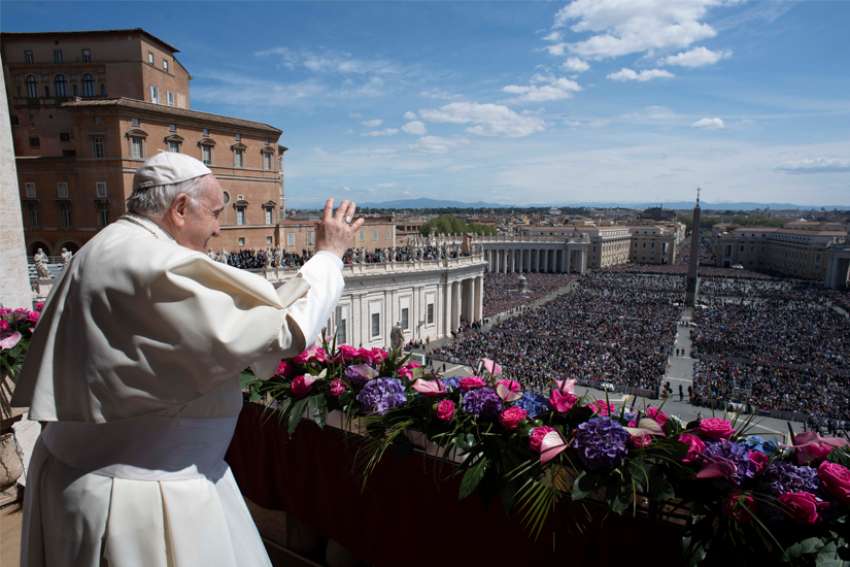 Pope Francis greet the crowd during his Easter message and blessing &quot;urbi et orbi&quot; (to the city and the world) delivered from the central balcony of St. Peter&#039;s Basilica at the Vatican April 17, 2022.