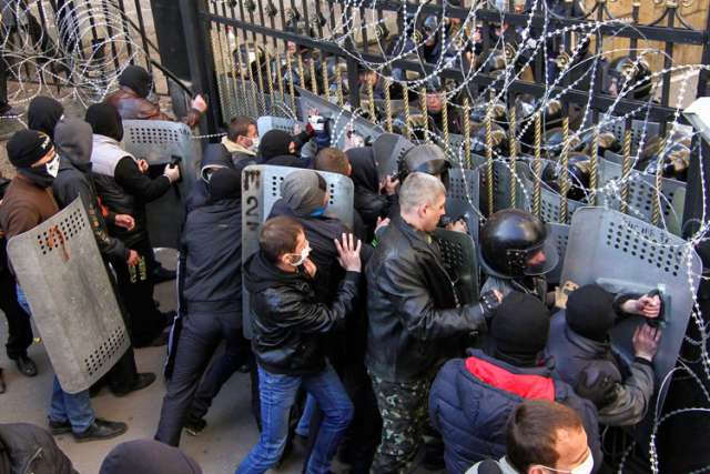 Pro-Russia protesters scuffle with the police at the regional government building in Donetsk, Ukraine, April 6.