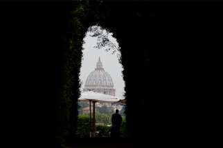 The dome of St. Peter&#039;s Basilica at the Vatican is seen from the Aventine Hill in Rome.