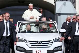 Pope Francis rides in his popemobile during his weekly audience in St. Peter&#039;s Square at the Vatican June 3.