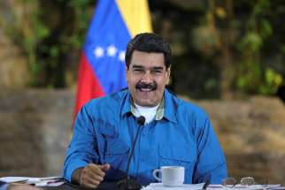 Nicolas Maduro is seen in La Guaira, Venezuela, Sept. 8. Juan Guaido declared himself the legitimate Venezuelan president during a news conference in Caracas Jan. 25, 2019.