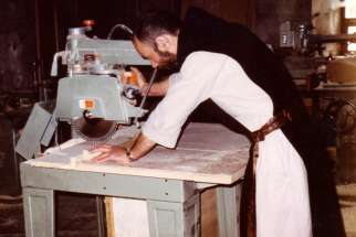  Father Christophe Lebreton works with a table saw at the Monastery of Notre Dame de l&#039;Atlas near Medea, Algeria, in this undated photo. Father Lebreton and six other Trappist monks murdered in 1996 by the members of the Armed Islamic Group will be beatified Dec. 8 in Oran, Algeria. 