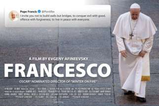 A poster for the new film, &quot;Francesco,&quot; by documentary filmmaker Evgeny Afineevsky, shows Pope Francis walking in St. Peter&#039;s Square at the Vatican.