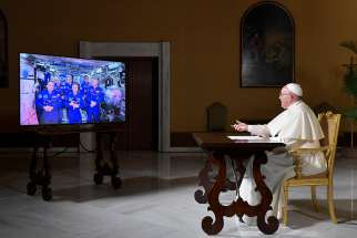 Pope Francis speaks from the Vatican to astronauts aboard the International Space Station Oct. 26. The pope connected for about 25 minutes to astronauts 250 miles above the earth.