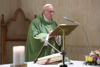 Pope Francis celebrates Mass in the chapel of his Vatican residence at the Domus Sanctae Marthae Sept. 26.