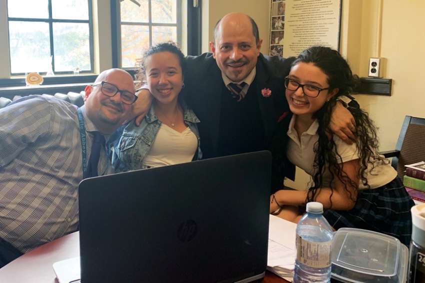 Cosmo Femia, third from left, and twin brother Damiano founded the Daughters of the Immaculate Heart of Mary club at Loretto Abbey Catholic Secondary School to empower students like Victoria and Olivia Marinelli to serve those in need of help both locally and globally.