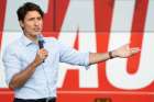Prime Minister Justin Trudeau gestures to a crowd in front of his campaign bus as he visits Cornwall, Ontario, Aug. 22.
