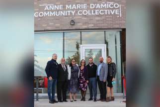 Members of Anne Marie D’Amico’s family, including mother Carmela, centre, and dad Rocco (second from left), take part in the unveiling of the community collective named after their sister and daughter.