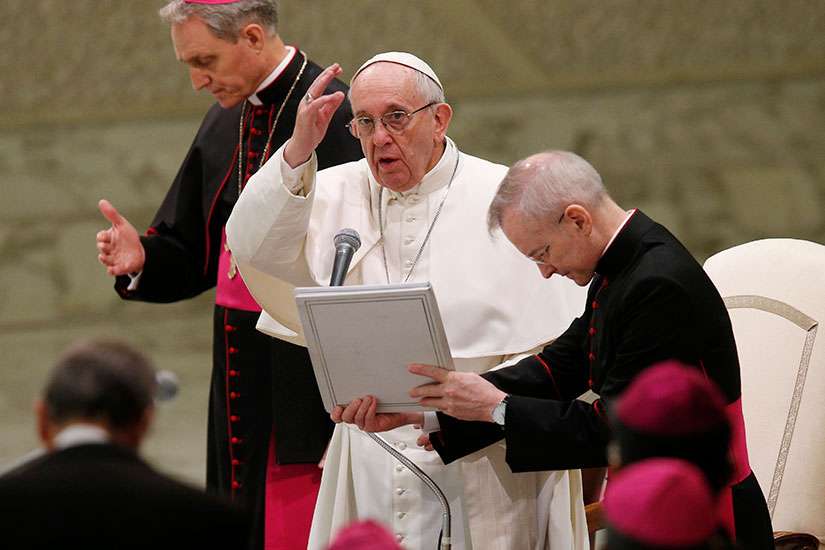 Pope Francis delivers his blessing during his general audience in Paul VI hall at the Vatican Jan. 25.