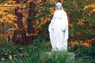 A statue of the Blessed Virgin greets visitors  to St. Mary’s Parish in Barrie, Ont.