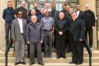 Priests from the parishes involved in the next wave of the One Heart, One Soul campaign — that begins in June — pose in front of the Chancery Office in Hamilton.