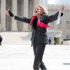 Edie Windsor, plaintiff in the lawsuit against the Defense of Marriage Act, gestures outside the Supreme Court in Washington March 27 after the justices heard oral arguments in the case. The court took up the constitutional challenge to the federal law a day after hearing arguments on the constitutionality of California&#039;s law banning same-sex marriage.