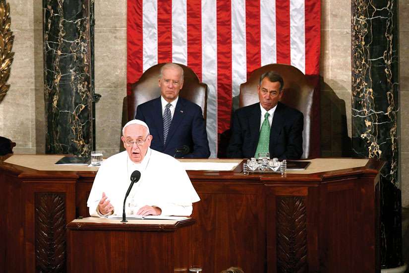 Pope Francis addresses a joint meeting of the U.S. Congress as Vice President Joe Biden (left) and Speaker of the House John Boehner look on in the House of Representatives Chamber at the U.S. Capitol in Washington Sept. 24.