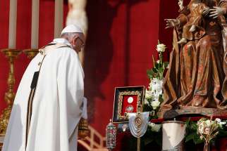 Pope Francis uses incense to venerate relics as he celebrates the canonization Mass for seven new saints in St. Peter&#039;s Square at the Vatican Oct. 14. Among the new saints are St. Paul VI and St. Oscar Romero.