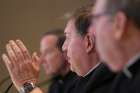 Cardinal Joseph W. Tobin of Newark, N.J., center, responds to a reporter&#039;s question during a news conference June 13, 2019, at the spring general assembly of the U.S. Conference of Catholic Bishops in Baltimore. Also pictured are Bishops Michael F. Burbidge of Arlington, Va., and Robert P. Deeley of Portland, Maine.