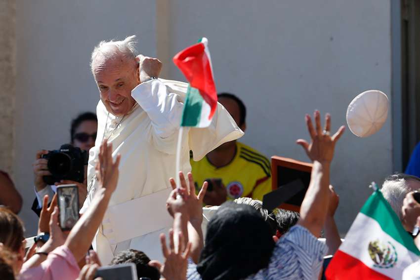 A gust of wind blows off Pope Francis&#039; zucchetto during his general audience in St. Peter&#039;s Square at the Vatican June 27.