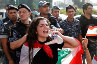 A woman shouts during an anti-government protest in Beirut Nov. 5, 2019. Hundreds of thousands of Lebanese are hitting the streets across the country to demand an end to rampant corruption and poor public services.