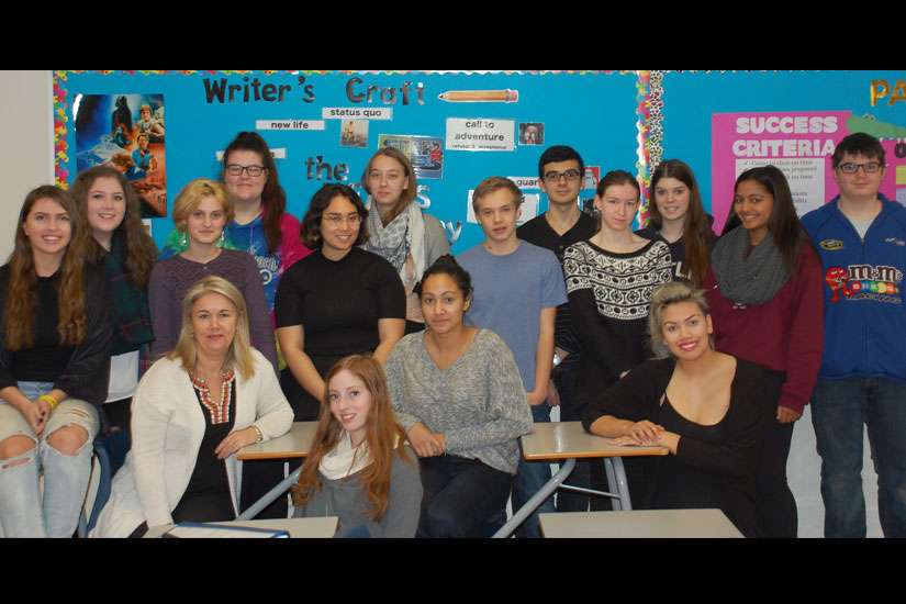 Caroline Pignat, seated at third from left, with her writer’s craft class at All Saints Catholic High School in Kanata, Ont. Pignat has just won her second Governor General’s Literary Award, which she will receive at a Dec. 2 ceremony at Rideau Hall.