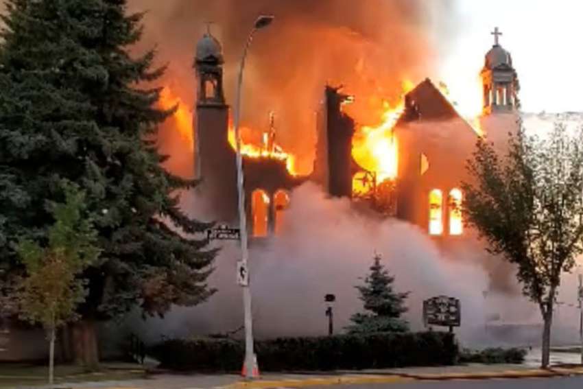 Flames engulf St. Jean Baptiste Church in Morinville, Alta., June 30, 2021, in this still image taken from video obtained from social media.
