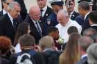 Catholic school students greet Pope Francis with flowers after he arrived at Joint Base Andrews in Maryland Sept. 22.