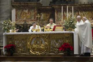 Archbishop Georg Gänswein, former secretary to Pope Benedict XVI, center, presides over the Eucharist during a memorial Mass on the first anniversary of the late pope&#039;s death at the Altar of the Chair in St. Peter&#039;s Basilica at the Vatican Dec. 31, 2023. Cardinal Kurt Koch, prefect of the Dicastery for Promoting Christian Unity, is at the left, and Cardinal Gerhard Muller, former prefect of the then-Congregation for the Doctrine of the Faith, is on the right.