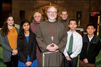On Jan. 24, members of the Franciscan Friars of the Atonement-Graymoor honoured the winners of the Friars’ Student Awards annual essay contest at a Mass at St. Joan of Arc parish in Toronto. Four of the six honoured were on hand, including, from left, second-place winner Raquel Seara, grand prize winner Sharanya Tiwari, third place winner Vincent Pham and honourable mention Brian Chen-See. Frs. Damian MacPherson, Brian Terry and Daniel Callahan, left to right, made the presentation.