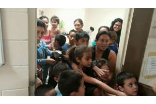 This handout photo courtesy of the office of U.S. Rep. Henry Cuellar, D-Texas, shows unaccompanied migrant children at a Department of Health and Human Services facility in south Texas. Many undocumented minors coming across the U.S. border claim they ar e escaping gang violence in their home countries.