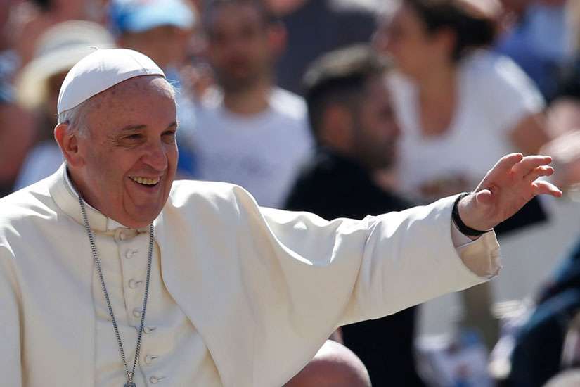 Pope Francis greets the crowd as he arrives to lead his general audience in St. Peter&#039;s Square at the Vatican May 27.