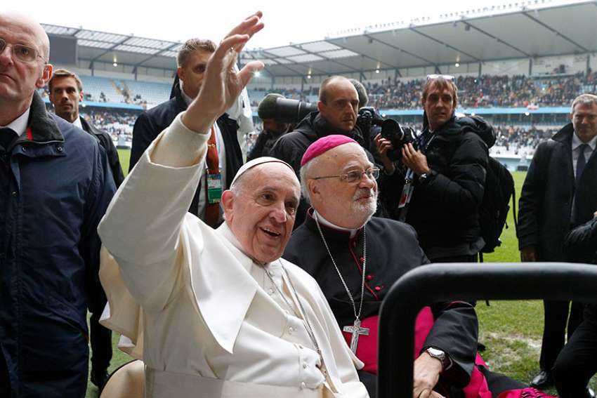 Pope Francis and Bishop Anders Arborelius of Stockholm ride in a golf cart as the pope greets the crowd before celebrating Mass in Malmo, Sweden, in this Nov. 1, 2016, file photo. Bishop Arborelius is among five new cardinals who will be created by the pope at a June 28 consistory.