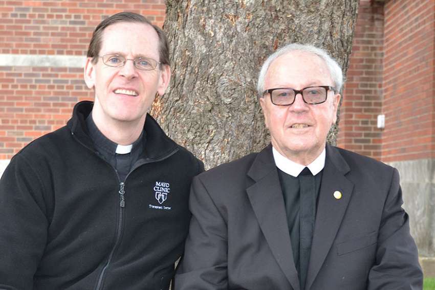 Father Scott Bullock and Christian Brother Stephen Markham pose together in late March in Dubuque, Iowa, about nine months after kidney transplant surgery. &quot;It is without a doubt the greatest gift you can give anyone,&quot; Brother Markham said of the donated kidney he received from his priest friend.