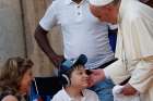 Pope Francis blesses a boy with a disability at the Father Felix Varela cultural center in Havana Sept. 20.