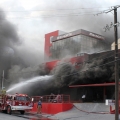 Firefighters work the scene of an arson attack at a building housing the Casino Royale in Monterrey, Mexico, Aug. 25.