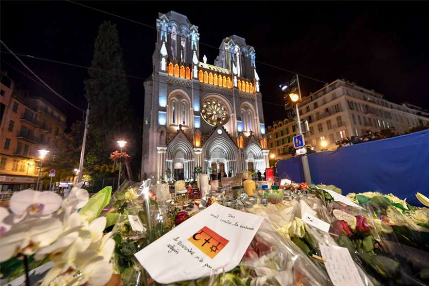 Tributes to the dead are seen outside of Notre Dame Basilica in Nice, France, Nov. 1, 2020, as French bishops conduct a &quot;penitential rite of reparation,&quot; following the Oct. 29 deadly attack at church. The penitential rite was deemed necessary to purify the church from the stain of the homicide before normal religious activities could resume in the basilica.